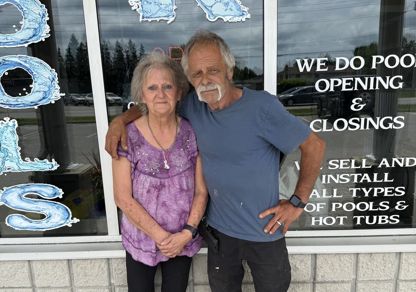 Armand & Michelle outside the Pools R Us storefront in Amherstburg