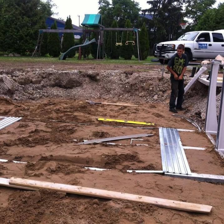 Pools R Us team at work on an installation